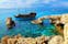 Photo of pirate ship sailing near famous Bridge of Love ,Cape Greco ,Ayia Napa, Cyprus. 