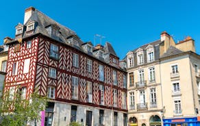 Photo of traditional half-timbered houses in the old town of Rennes, Brittany, France.
