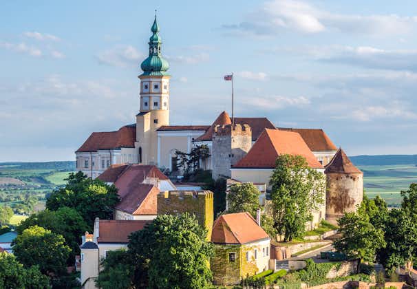 Photo of aerial view of Mikulov castle or Mikulov Chateau on top of rock in Mikulov, Moravia, Czech Republic.