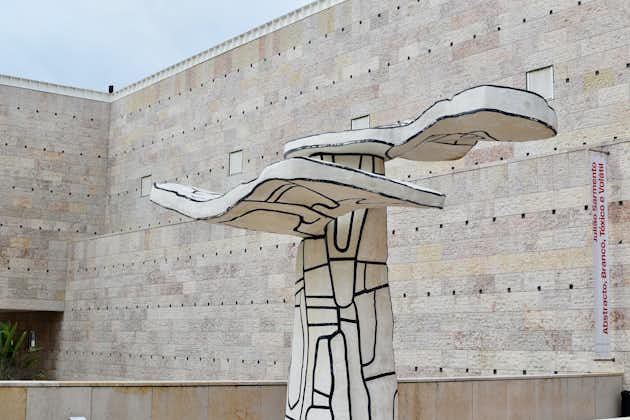 Photo of a sculpture in front of a brick building, Berardo Collection Museum,Portugal.