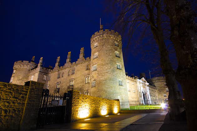 Photo of Kilkenny Castle at night, historic landmark in the town of Kilkenny in Ireland.