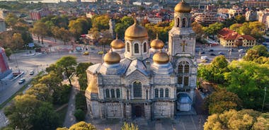 Photo of aerial view of The Cathedral of the Assumption and Varna city at amazing sunset, Bulgaria.