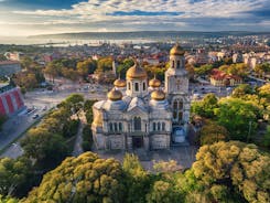 Photo of aerial view of The Cathedral of the Assumption and Varna city at amazing sunset, Bulgaria.