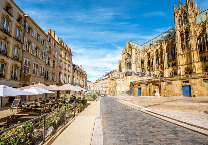 Photo of street view on the central square with famous cathedral in Metz city in Lorraine region of France.
