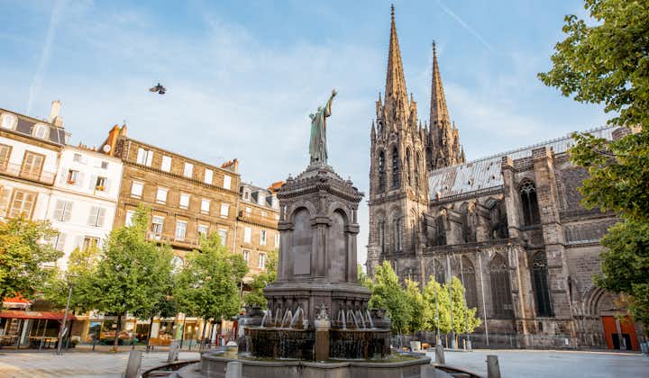 Statue of Vercingétorix and Basilica Notre-Dame-du-Port in Victory Square in Clermont-Ferrand, France