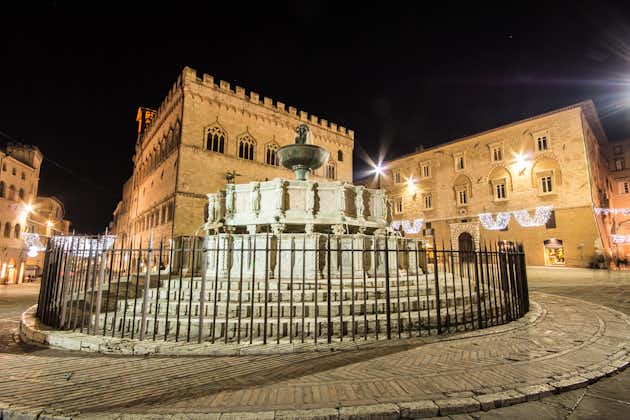 photo of view of Maggiore Fountain on illuminated Piazza IV Novembre, Perugia, Italy.