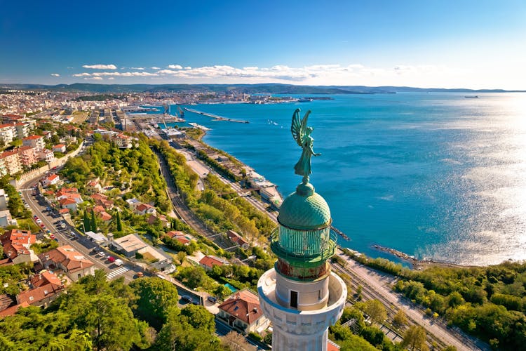 Trieste lighthouse Phare de la Victoire and cityscape panoramic aerial view, Friuli Venezia Giulia region of Italy.