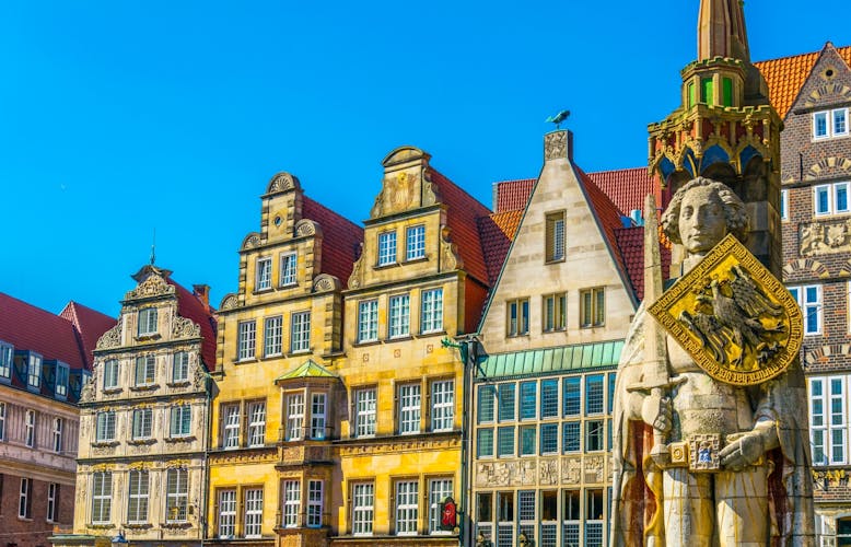 Photo of colorful facades with bremer roland statue in Bremen, Germany.