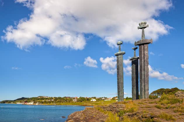 Photo of three large swords Sverd i Fjell stand on the hill as a memory to the Battle of Hafrsfjord in year 872 in Stavanger, Norway.