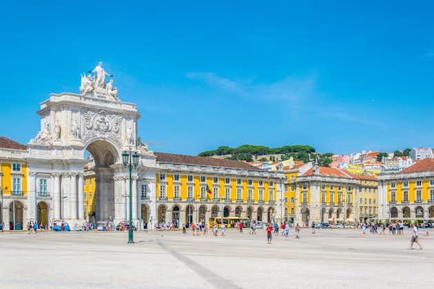 Photo of People are passing in front of the arco da rua augusta in Lisbon, Portugal.