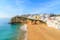 Photo of Carvoeiro fishing village with beautiful beach and colourful houses, Portugal.