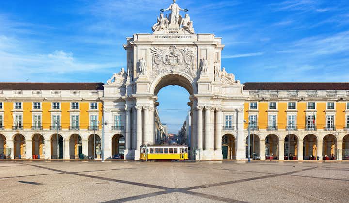 Photo of Praca do Comercio with yellow tram, Lisbon, Portugal.