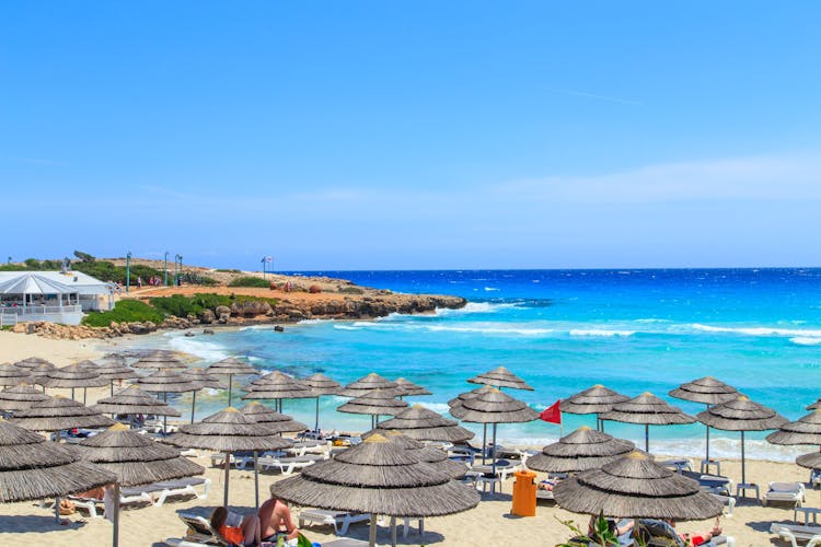 Photo of famous Nissi beautiful sand beach and azure water, Ayia Napa, Cyprus.
