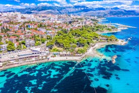 photo of a beautiful panoramic view of Kastel Luksic harbor and landmarks summer view, Split region of Dalmatia, Croatia.