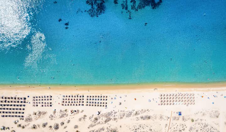 Photo of Aerial top view of the popular Agios Prokopios beach at Naxos island with emerald sea and fine sandy beach.