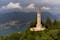 Aerial view of the Faro Voltiano (Volta Lighthouse) in Brunate, with the skyline of Lake Como, green forest and trees near Milan, Italy
