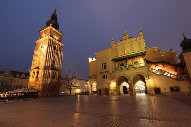 Nightime image of the Town Hall Tower and the Cloth Hall, Market Square, Krakow, Poland, Europe.