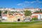 Monastery of Santa Clara a Velha in Coimbra, Portugal, on a sunny day and in the background the hill with its houses and at the top the Monastery of Santa Clara a Nova.