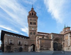 photo of summer view of Teruel with landmarks (Cathedral of Santa María de Mediavilla, Mausoleum of the Amantes) in Aragon, Spain.
