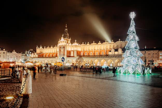 Fantastic view of the Christmas, New Year's Fair in KRAKOW. Main Market Square and Sukiennice (The Cloth Hall) in the evening.