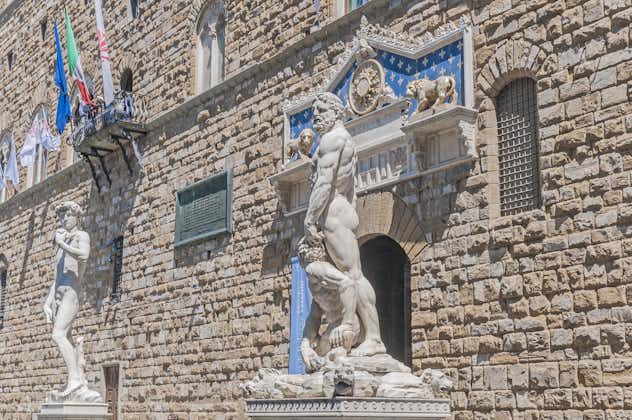 photo of Hercules and Cacus statue by Baccio Bandinelli in front of the Palazzo Vecchio at Piazza della Signoria in Florence, Italy
