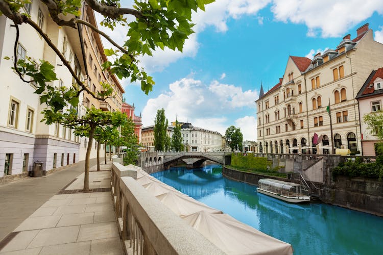 Photo of Ljubljana river embankment in downtown on central street.