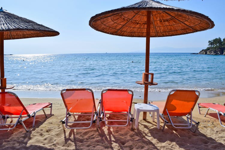 Photo of sun loungers on the beach in Kavala, Greece.