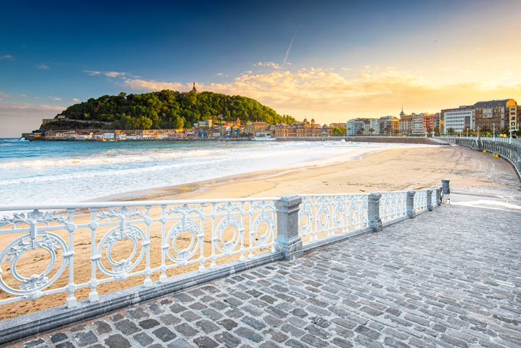 Photo of nice beach with the old town of San Sebastian, Spain in the morning.