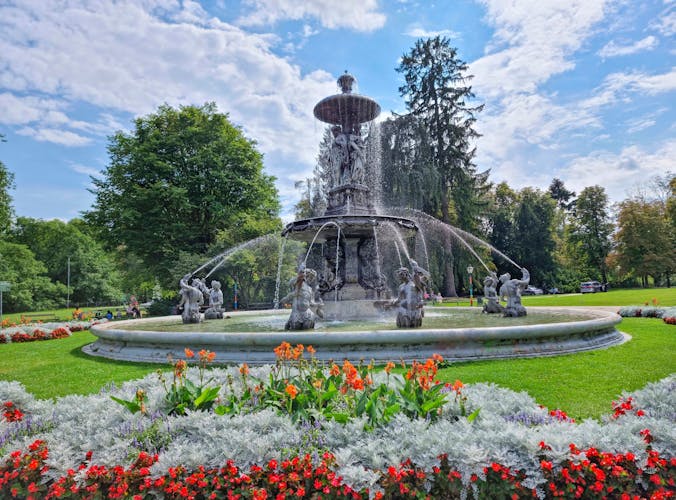 Photo of beautiful fountain in the city park Stadtpark, a green island in the middle of the city center of Graz.