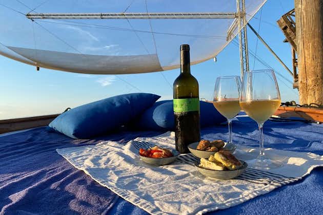 Aperitif at sunset in the Venice lagoon on a private boat.