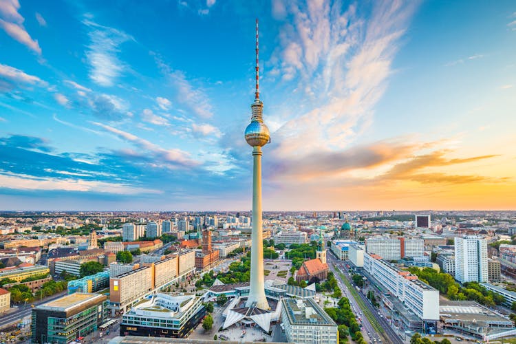 Photo of aerial view of Berlin skyline with famous TV tower at Alexanderplatz at sunset, Germany.