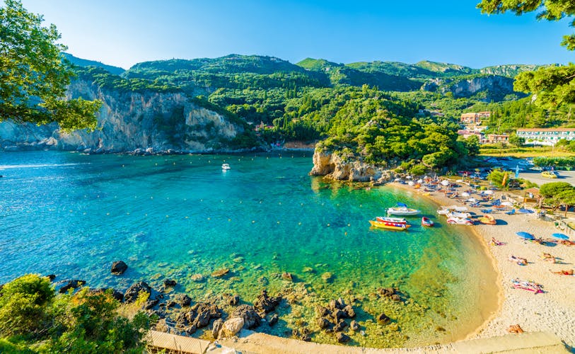 Photo of beautiful beach and boat in Paleokastritsa, Corfu island, Greece.