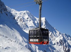 Photo of The winter view on the montains and ski lift station in French Alps near Chamonix Mont-Blanc.