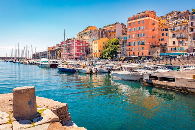 Photo of colorful houses on the shore of Bastia port.