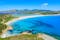 Photo of aerial view of a beautiful bay with azure sea from top of a hill, Villasimius, Sardinia island, Italy.