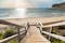 photo of wooden gangway with staircase leading to one of the beautiful beaches of the "Cuatro Calas" area (meaning: "Four Coves") Spain. Sun and sky on the background.