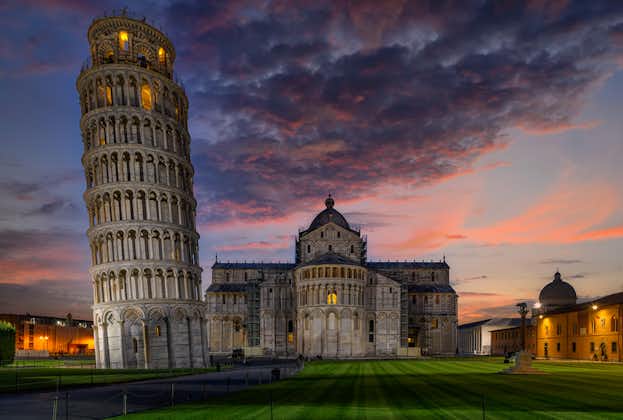photo of night view of cathedral (Duomo di pisa) with the leaning tower of pisa (Torre di pisa) on piazza dei miracoli in pisa, Tuscany, Italy.