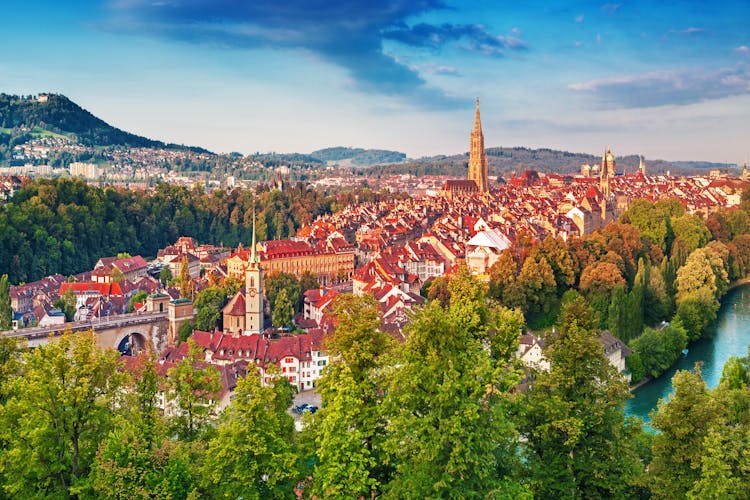 Photo of old Town of Bern, capital of Switzerland, covered with colorful sunrise.