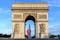 Photo of Arc de Triomphe  Early in the morning with the French flag, France.
