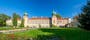 Łańcut castle in Poland. Built in the first half of 17th century. Front view panorama with a lawn, and roses