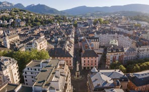 Photo of morning cityscape view with mountains, river and bridge in Grenoble city on the south-east of France.