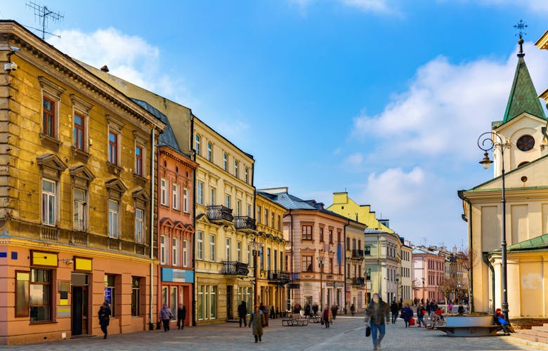 Photo of traditional colored tenements houses on central streets of Polish city of Lublin in sunny spring day.