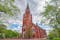 Photo of the neo-gothic Central Pori church built of redbrick was completed in 1863 in accordance with the drawings made by architect Carl-Johan von Hcideken and was restored In 1995 -1996, Pori, Finland.