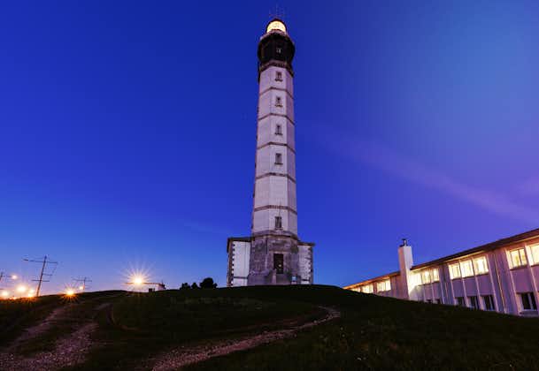 photo of Calais Lighthouse at night in Calais, France.