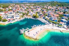 Photo of aerial view of Brodarica village near Sibenik beach and coastline, Dalmatia region of Croatia.