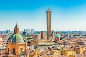 Photo of Italy Piazza Maggiore in Bologna old town tower of town hall with big clock and blue sky on background, antique buildings terracotta galleries.