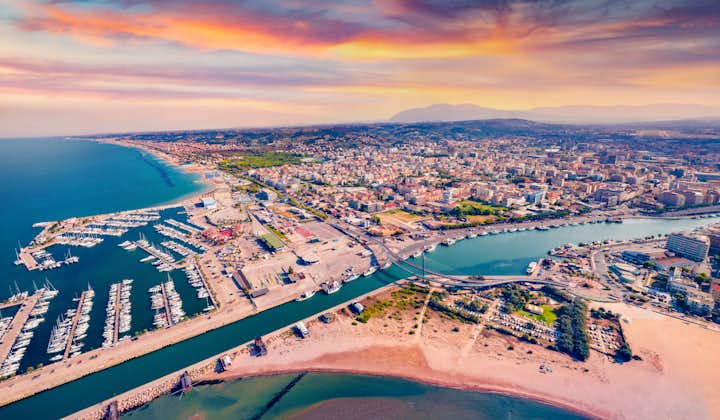 Spectacular summer view from flying drone Pescara port. Attractive sunset on Adriatic sea. Breathtaking evening scene of Italy, Europe.