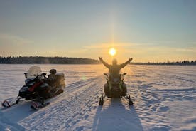 Day tour with snowmobile in Kiruna