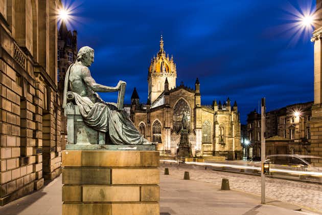 David Hume statue in front of St Giles Cathedral at dusk, Edinburgh ,Scotland UK.