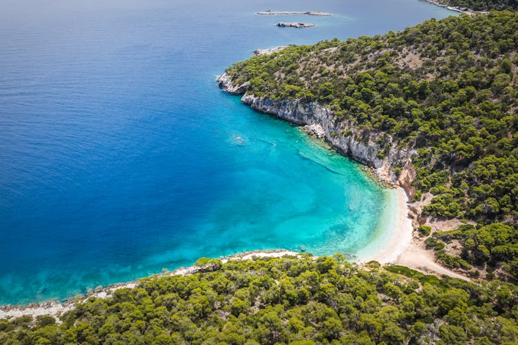 Photo of aerial view of seals cave and beautiful beach in Loutraki, Greece.